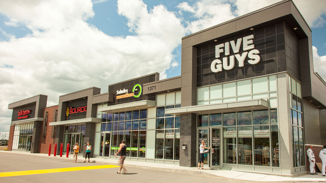 Image of Five Guys quick-serve restaurant and other affordable tenants at the SmartCentres Blainville commercial retail property 