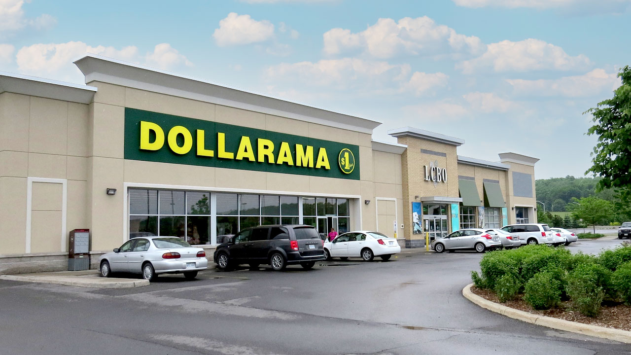 Image of a dollar store and liquor store at the SmartCentres Rockland open-air shopping centre